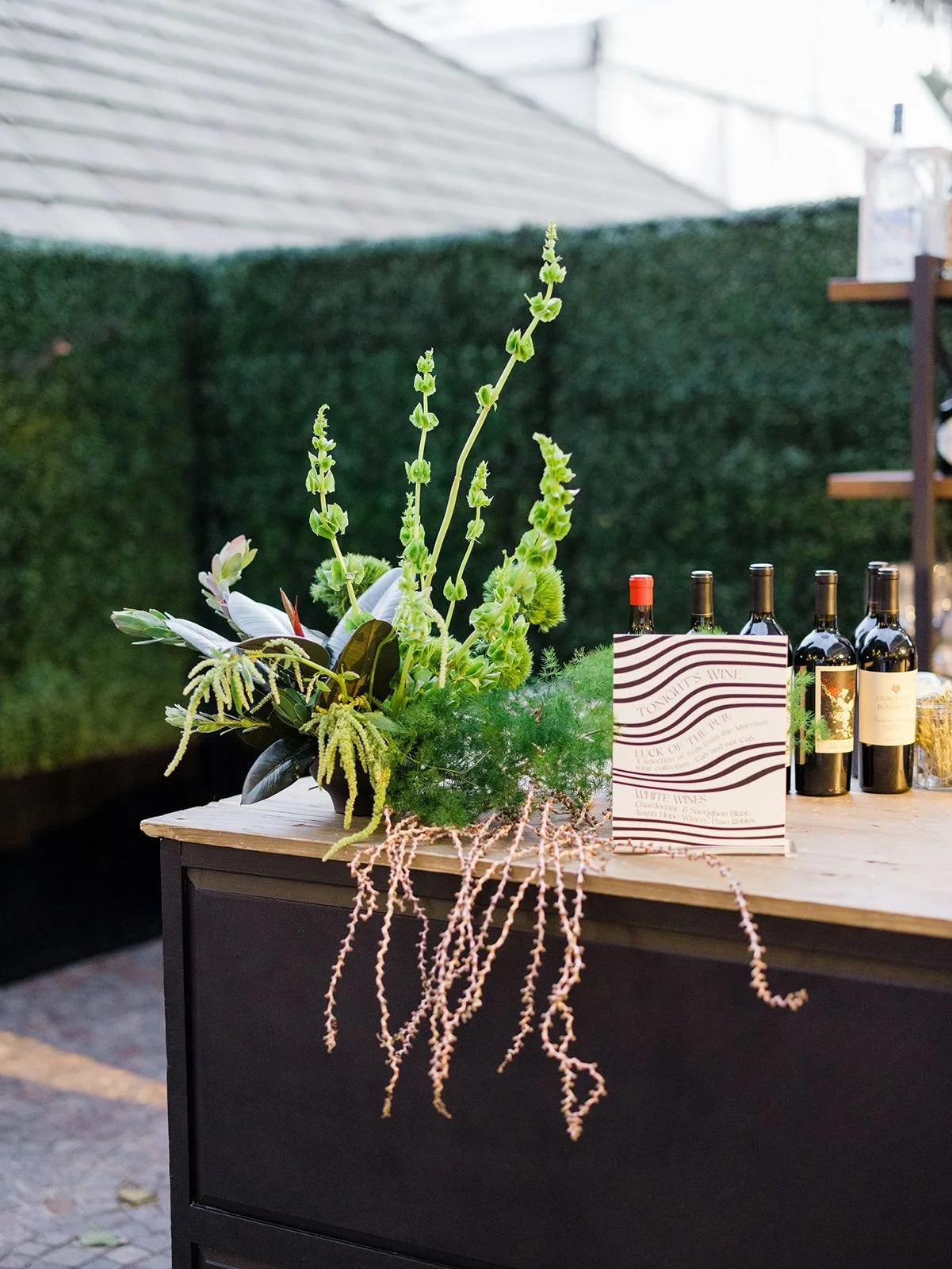 Statement bar installation with trailing greenery